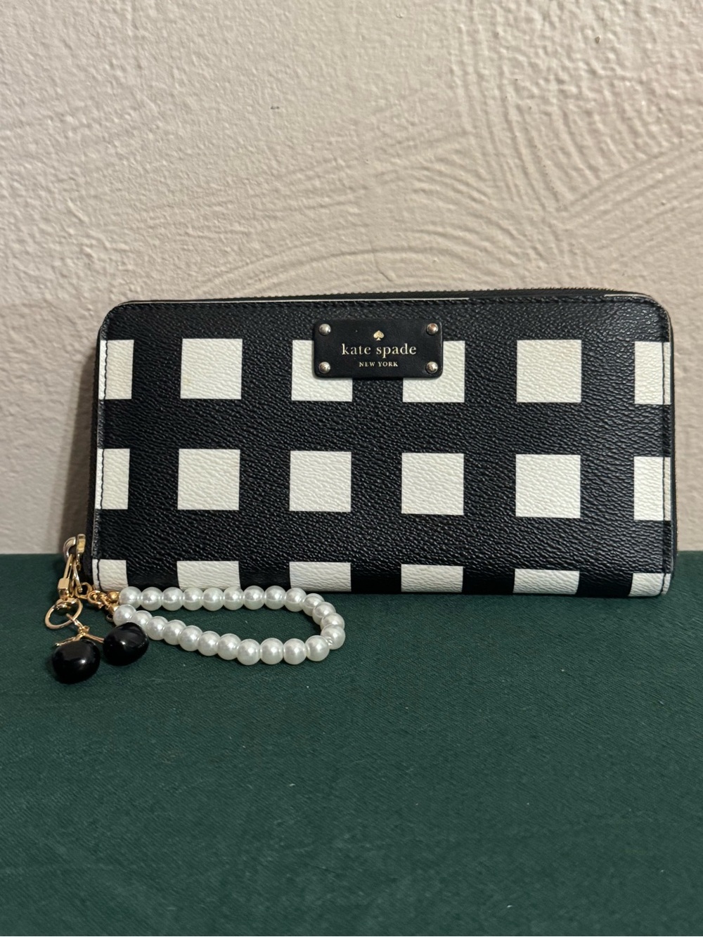 kate spade Black and White Check Zip-Around Wristlet with Pearl Strap